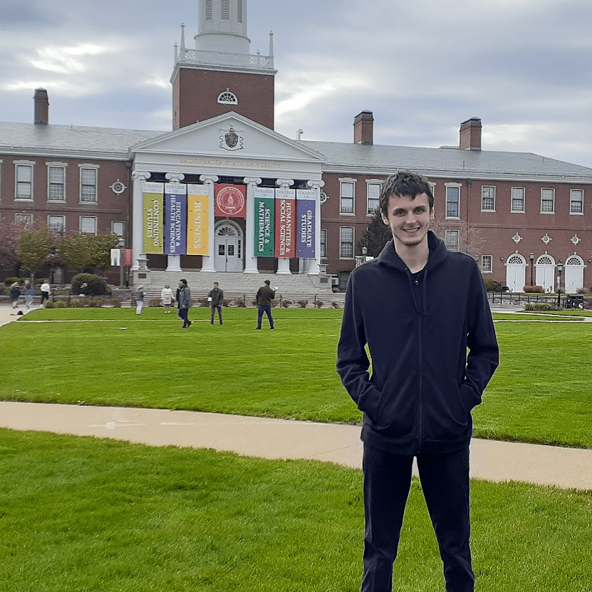 Dom Z standing in front of Bridgewater State University
